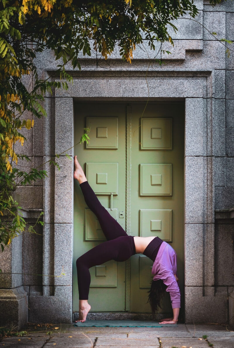 yoga pose upside down next to doors