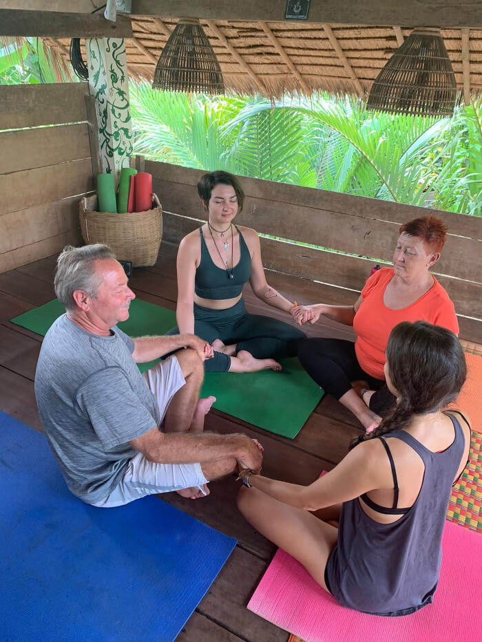 people in a circle meditating